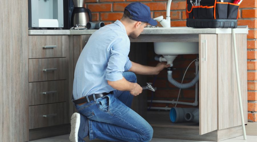 professional plumber fixing sink - Elizabeth Drain and Plumbing Services | Elizabeth, NJ