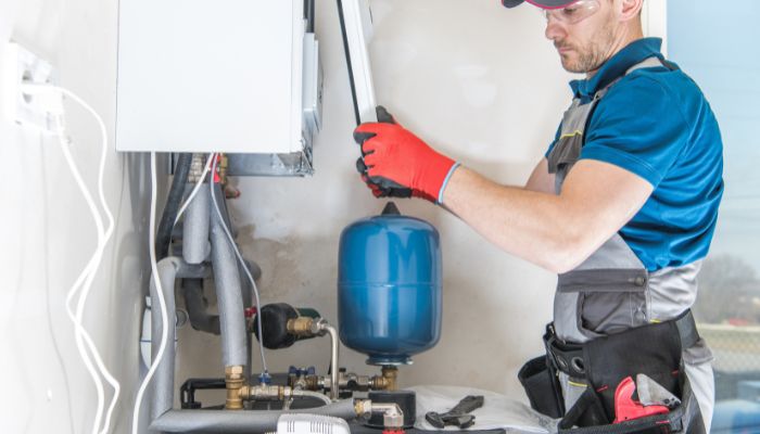 plumber repairing a water heater - Elizabeth Drain and Plumbing Services | Elizabeth, NJ