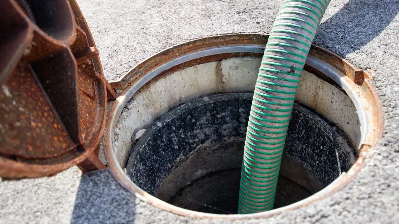 Camera line entering a sewer access point during an inspection in Elizabeth, NJ